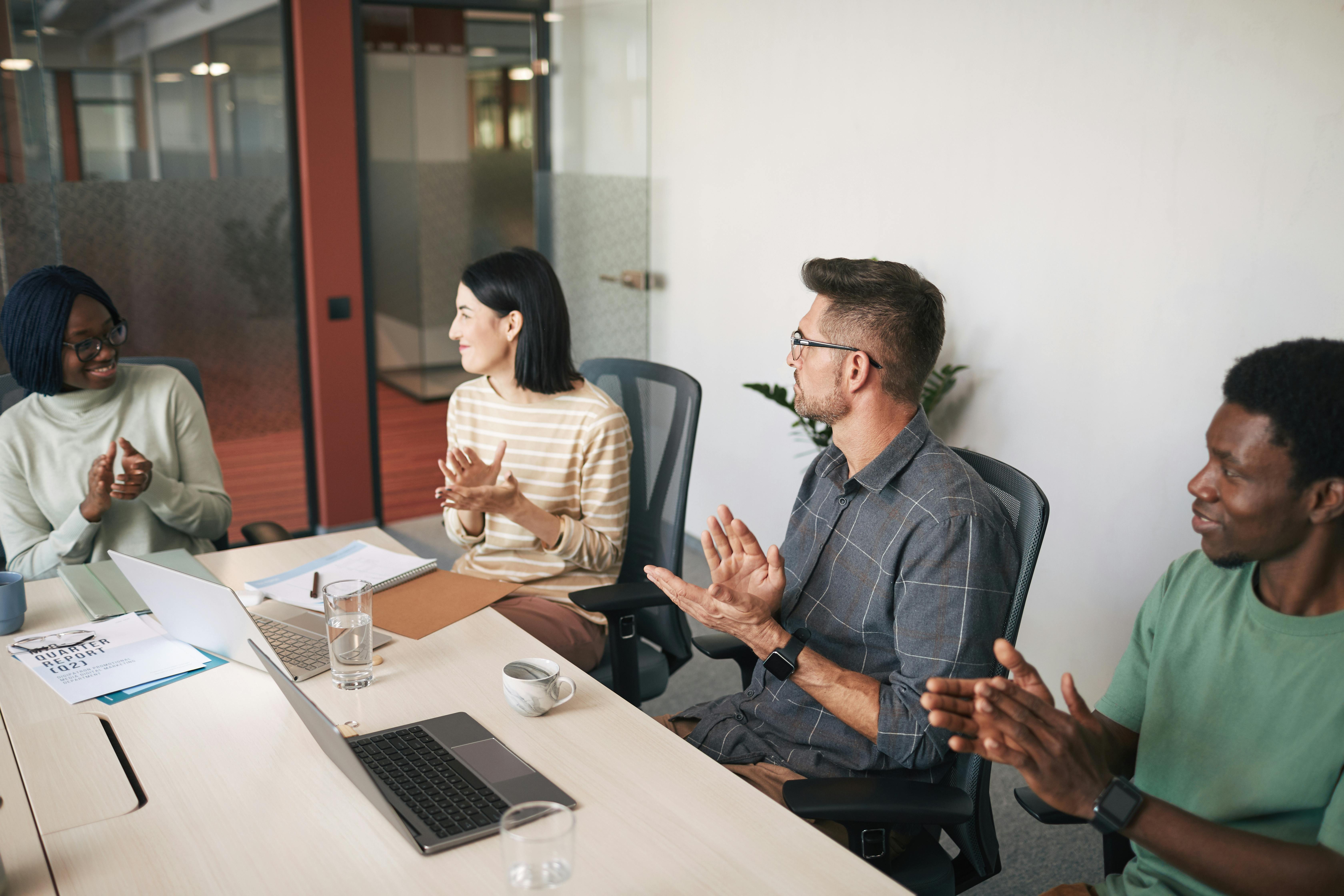 Financial advisory meeting focused on investment data and laptop analytics