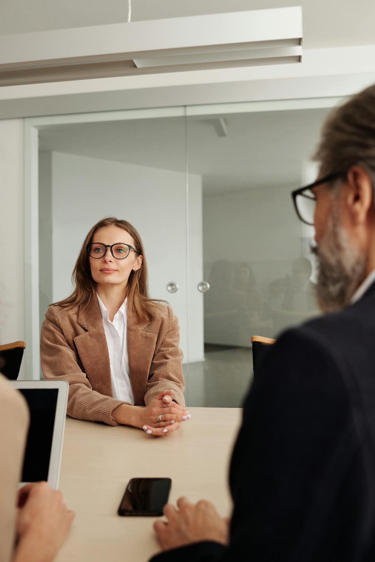 Professionals in a formal business meeting reflecting integrity and ethical decision-making